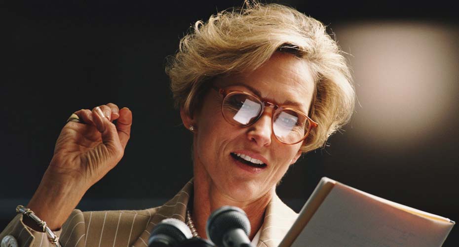 Woman talking into a microphone