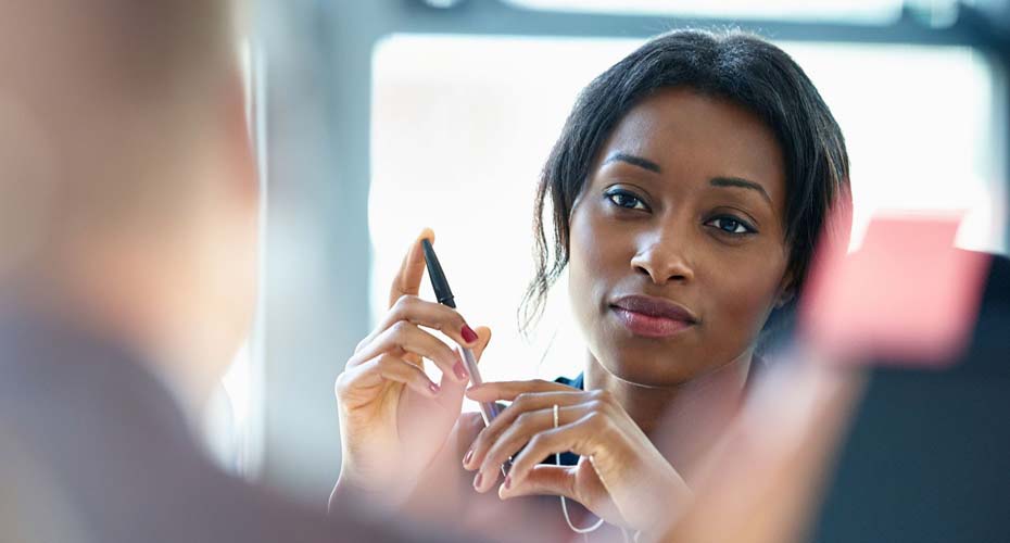 Business woman holding pen
