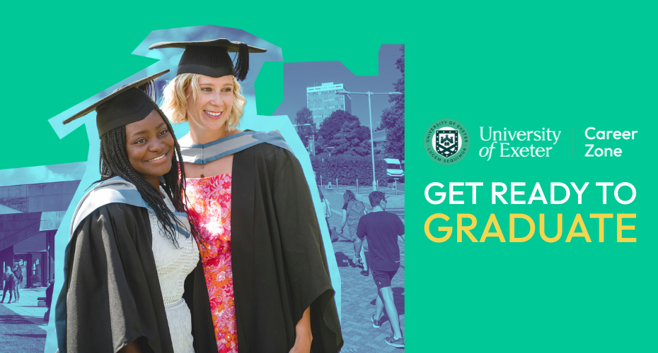Two graduates wearing graduation gowns and smiling